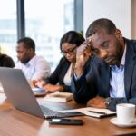 An executive experiencing burnout while maintaining team productivity